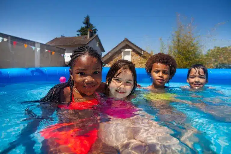 Kids in a pool playing together